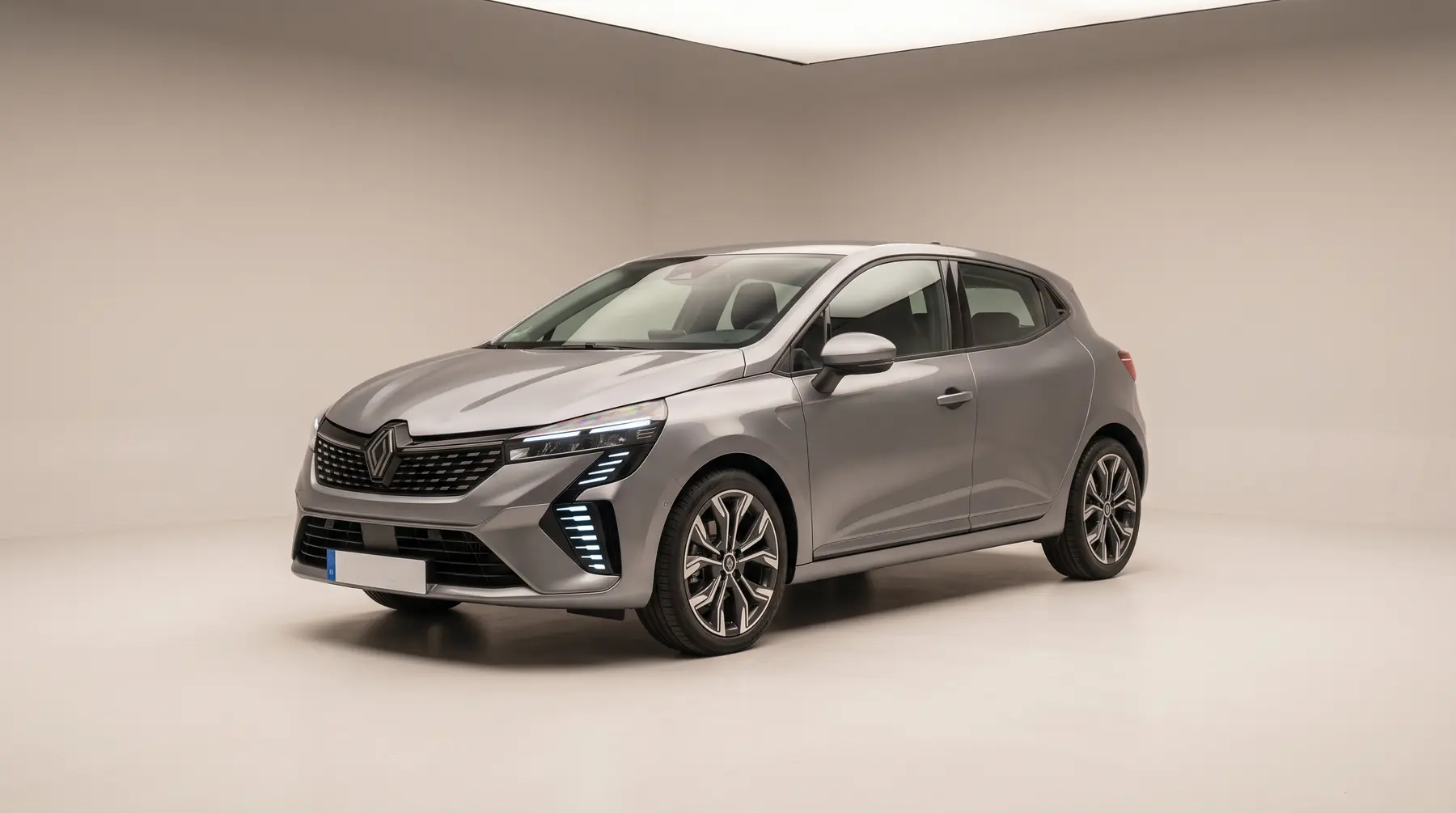 A grey hatchback in a studio