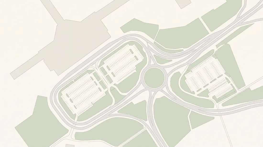 A pale drawn map of a long terminal building with car parks, a roundabout and roads around it