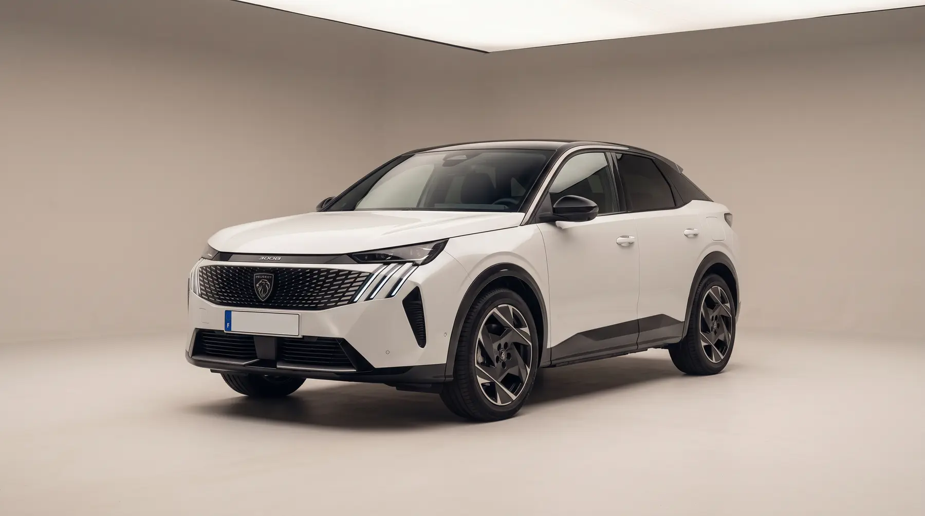 A white SUV in a studio