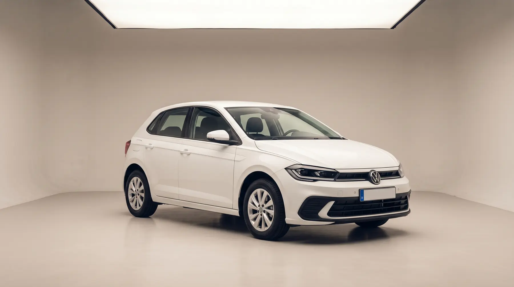 A white hatchback in a studio